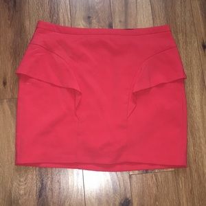 Coral colored peplum mini skirt